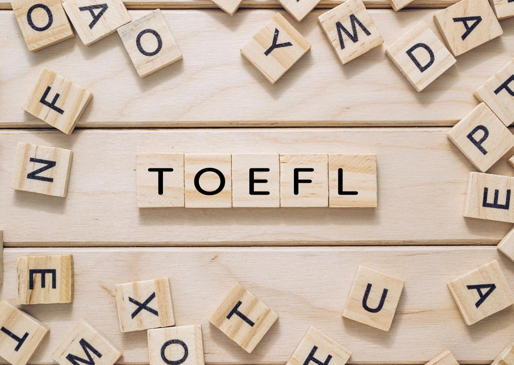 kobi education-universitas luar negeri yang menerima toefl itp-gambar kayu yang menunjukkan kata toefl